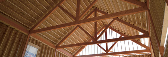 Domaine St-Jacques, Saint-Jacques-le-Mineur en Montérégie - Bâtiment de 30 pi x 120 pi destiné au vieillissement et au stockage du vin avant l’embouteillage, construit en bois d’ingénierie. Les murs et l’ossature secondaire du toit sont réalisés en ossature légère.